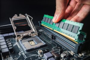 Installing a new RAM DDR memory for a personal computer processor socket in a service Upgrade repair PC upgrade or repair concept